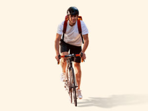 rewards-header Ein Mann sitzt auf einem Fahrrad.